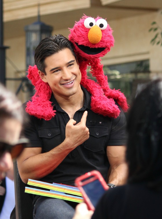 Mario Lopez with Tickle Me Elmo