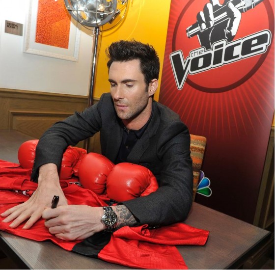 Adam Levine signs autographs