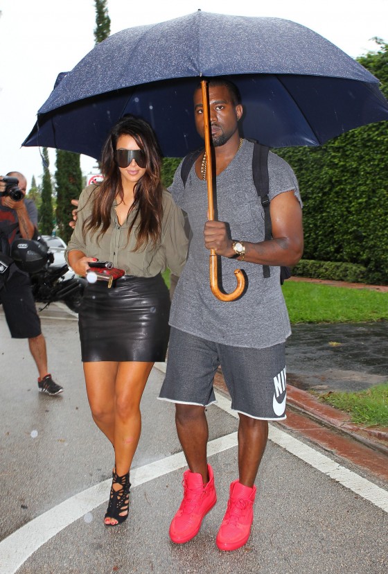 Kim Kardashian and Kanye West get stuck in rain