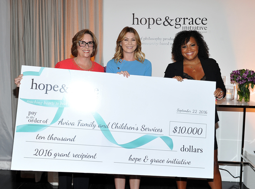 Regina Bette, CEO and President of Aviva Family and Children's Services, Grey’s Anatomy actress, Ellen Pompeo, and Tiffani Carter-Thompson, Vice President, Global PR, Social Media and Charity at philosophy, honor Aviva with the hope & grace initiative check at the 'Age of Cool' hosted by philosophy and Ellen Pompeo