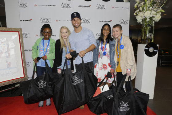 BEVERLY HILLS, CA - FEBRUARY 11: Make-A-Wish kids pose with singer-songwriter Jake Miller (C) at the GBK Pre-Grammy Lounge at the McLaren Auto Gallery on February 11, 2017 in Beverly Hills, California. (Photo by Tiffany Rose/Getty Images for GBK)