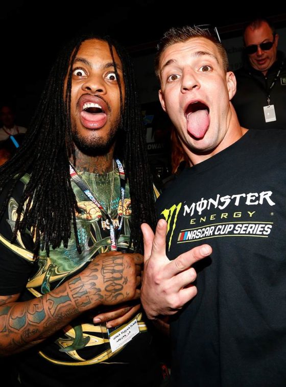 Rob Gronkowski and Waka Flocka Flame pose in the drivers meeting before the DAYTONA 500 