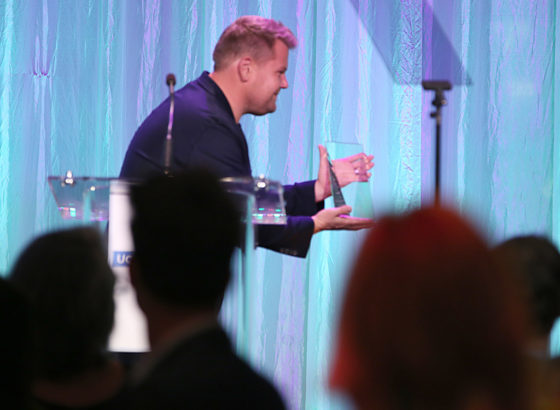 Presenter James Corden presents The Gil Nickel Humanitarian Award to honorees Yael and Scooter Braun